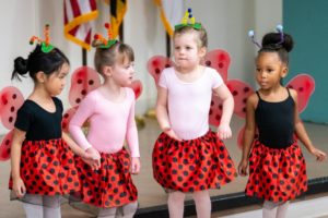 Young dancers in ladybug costumes